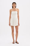 White strapless mini dress shown in a front studio view, highlighting the fitted bust and softly flared skirt.