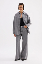 A model wears the Steel Calvi Boyfriend Jean with a matching grey denim shirt in a full-length studio view.