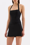 Three-quarter front view of the black top showing the fitted silhouette and halter neckline.
