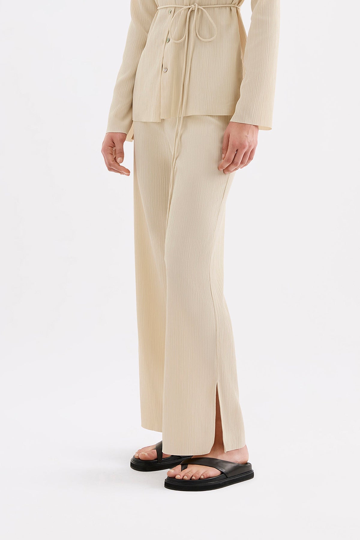 Three-quarter side view highlighting the relaxed fit and subtle side slit detail.