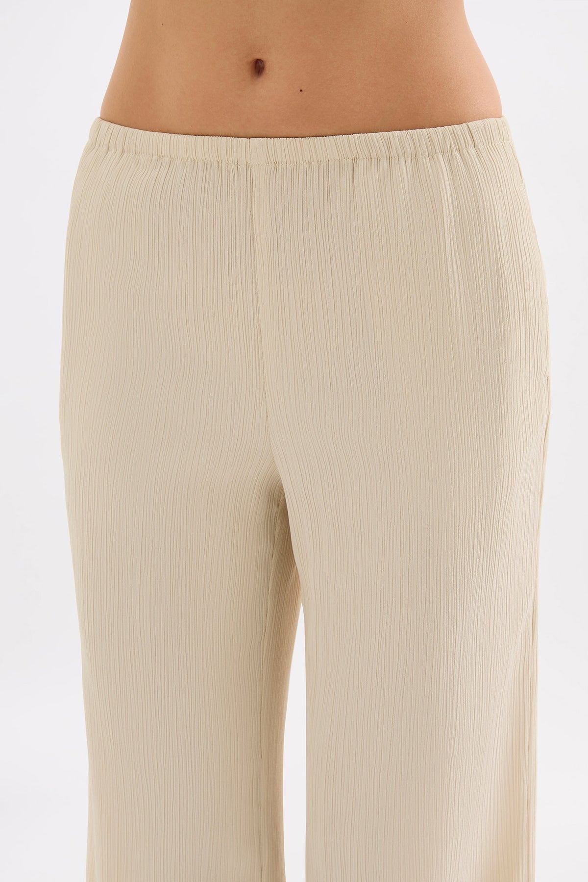 Close-up front view showing the elasticated waistband and textured crinkle fabrication.