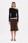 Full-length front view styled with a brown midi skirt, showing the fitted hip-length silhouette.