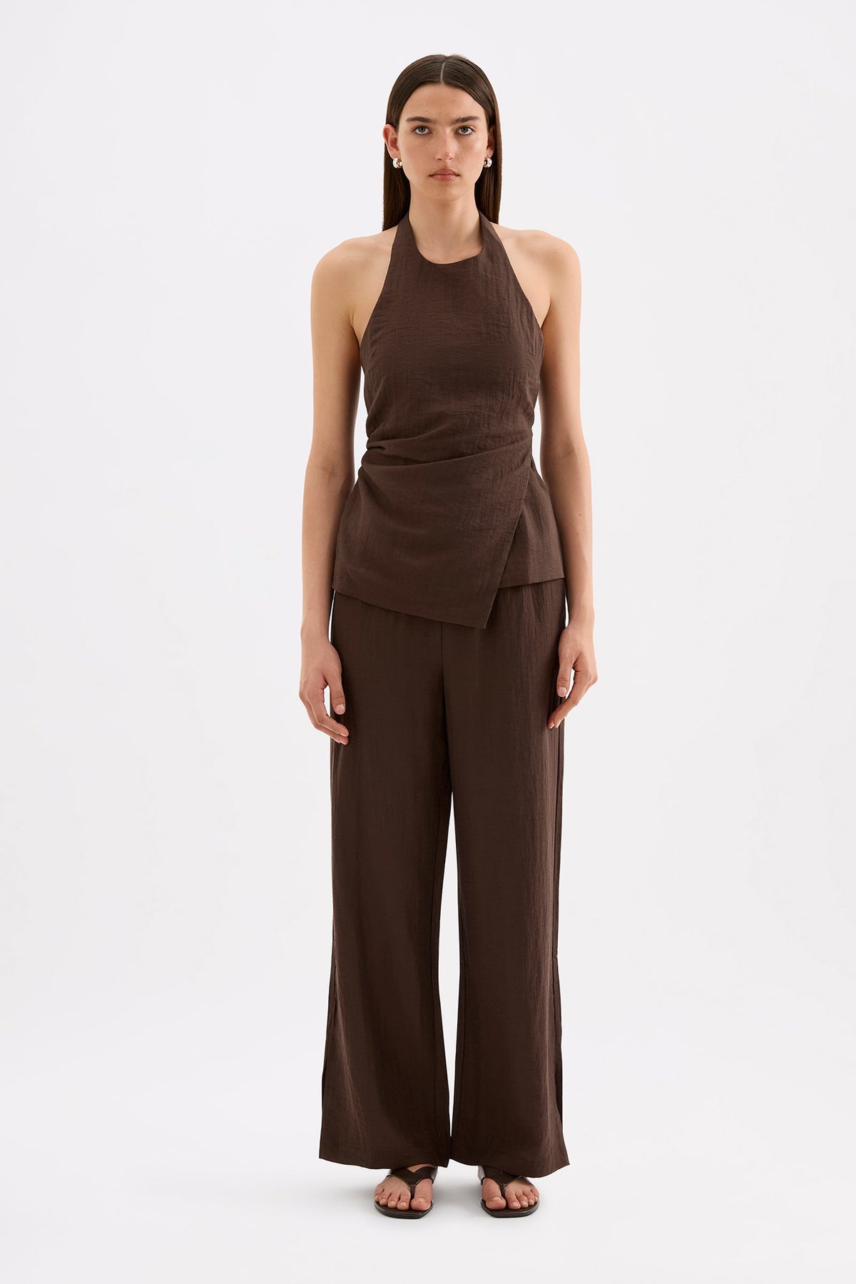 Full-length front view of the chocolate halter top styled with matching wide-leg pants against a white studio background.