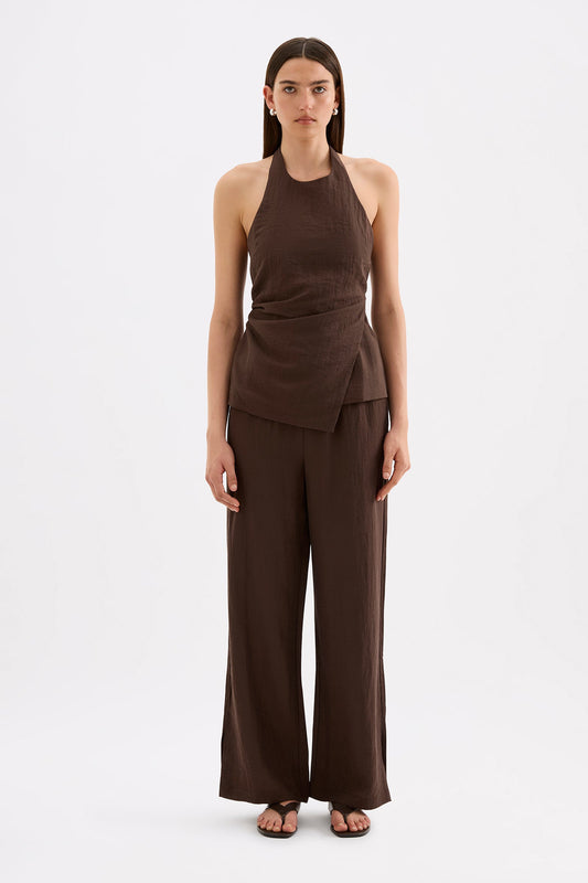 Full-length front view of the chocolate halter top styled with matching wide-leg pants against a white studio background.