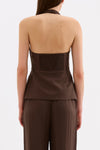 Back view showing the halter shape, shirred back panel and hip-length silhouette with matching pants.