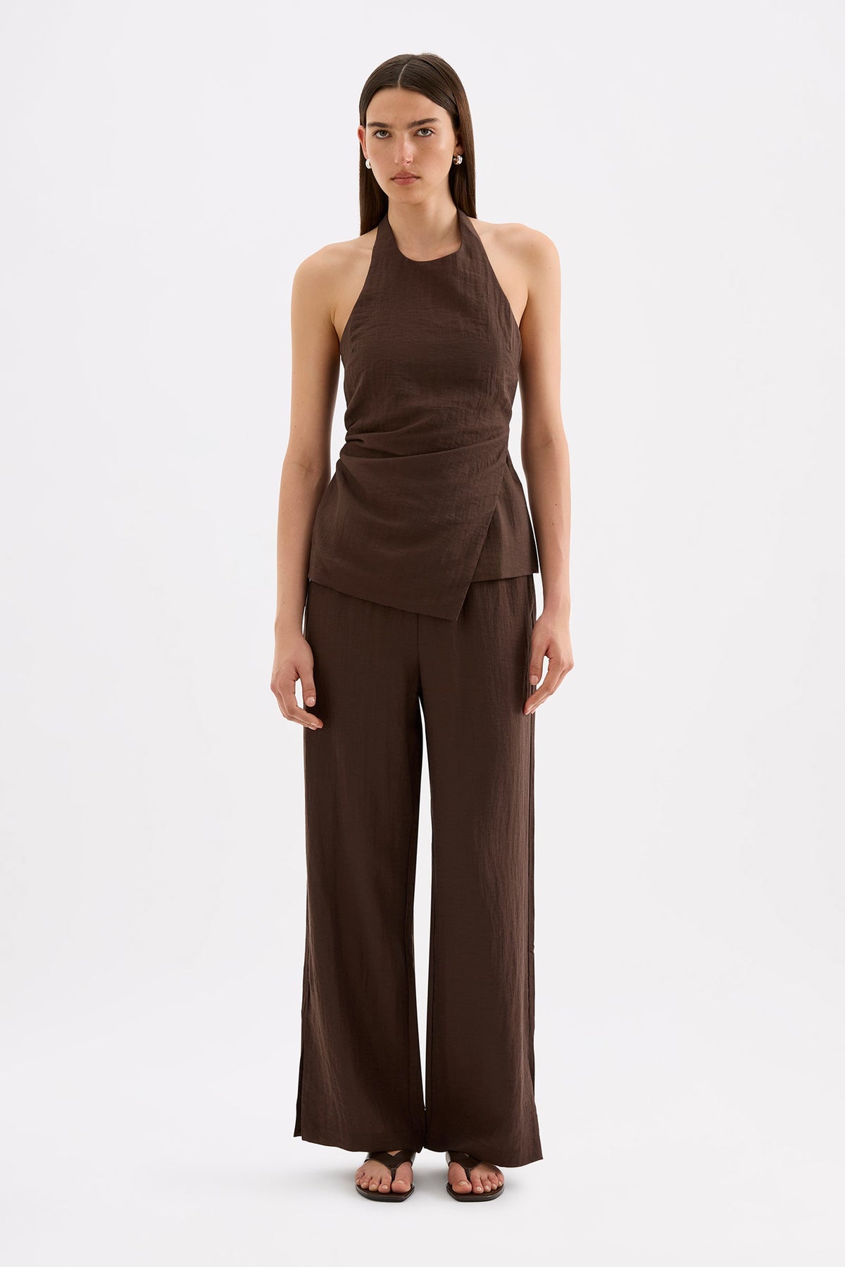 Full-length front view of the chocolate wide-leg pants styled with the matching halter top against a white studio background.