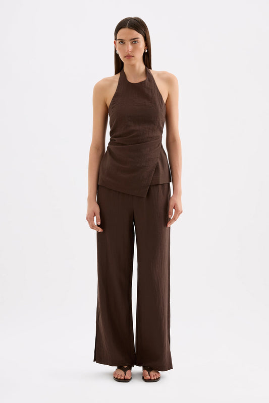 Full-length front view of the chocolate wide-leg pants styled with the matching halter top against a white studio background.