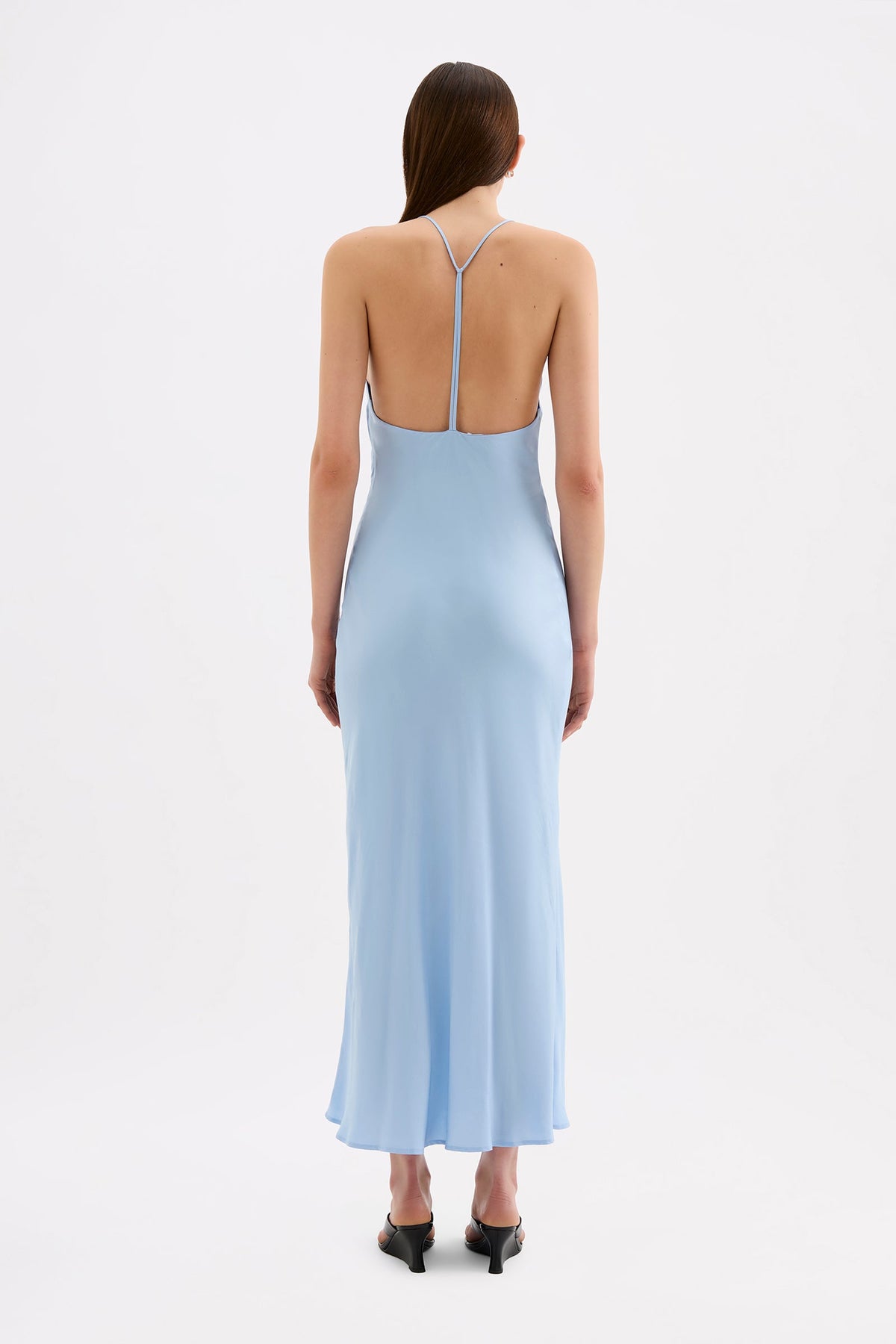 Back view of the Bermuda blue maxi dress showing the thin straps, open back and knot detail.