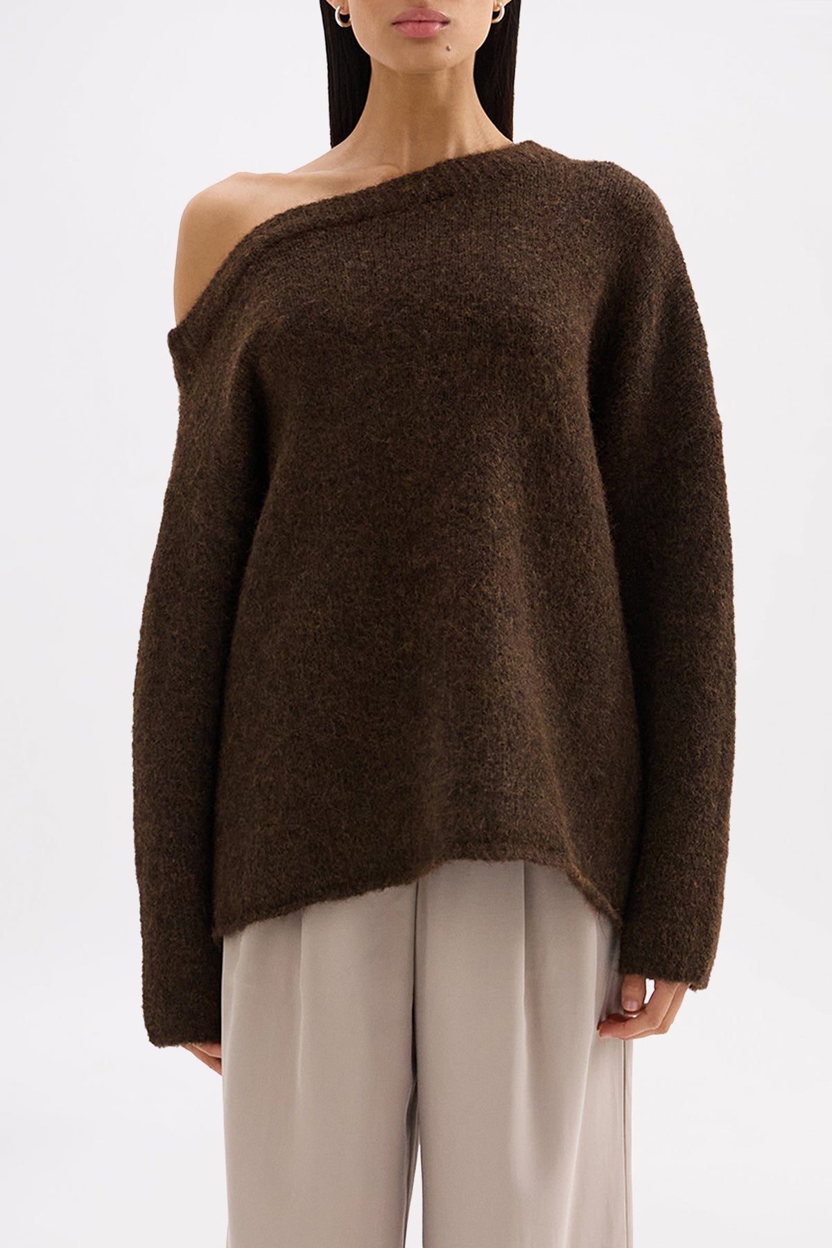 Front close view of the chocolate knit showing the asymmetrical neckline and relaxed oversized fit.