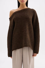 Front close view of the chocolate knit showing the asymmetrical neckline and relaxed oversized fit.