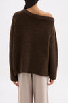 Back view of the chocolate knit showing the relaxed shape and off-shoulder neckline.