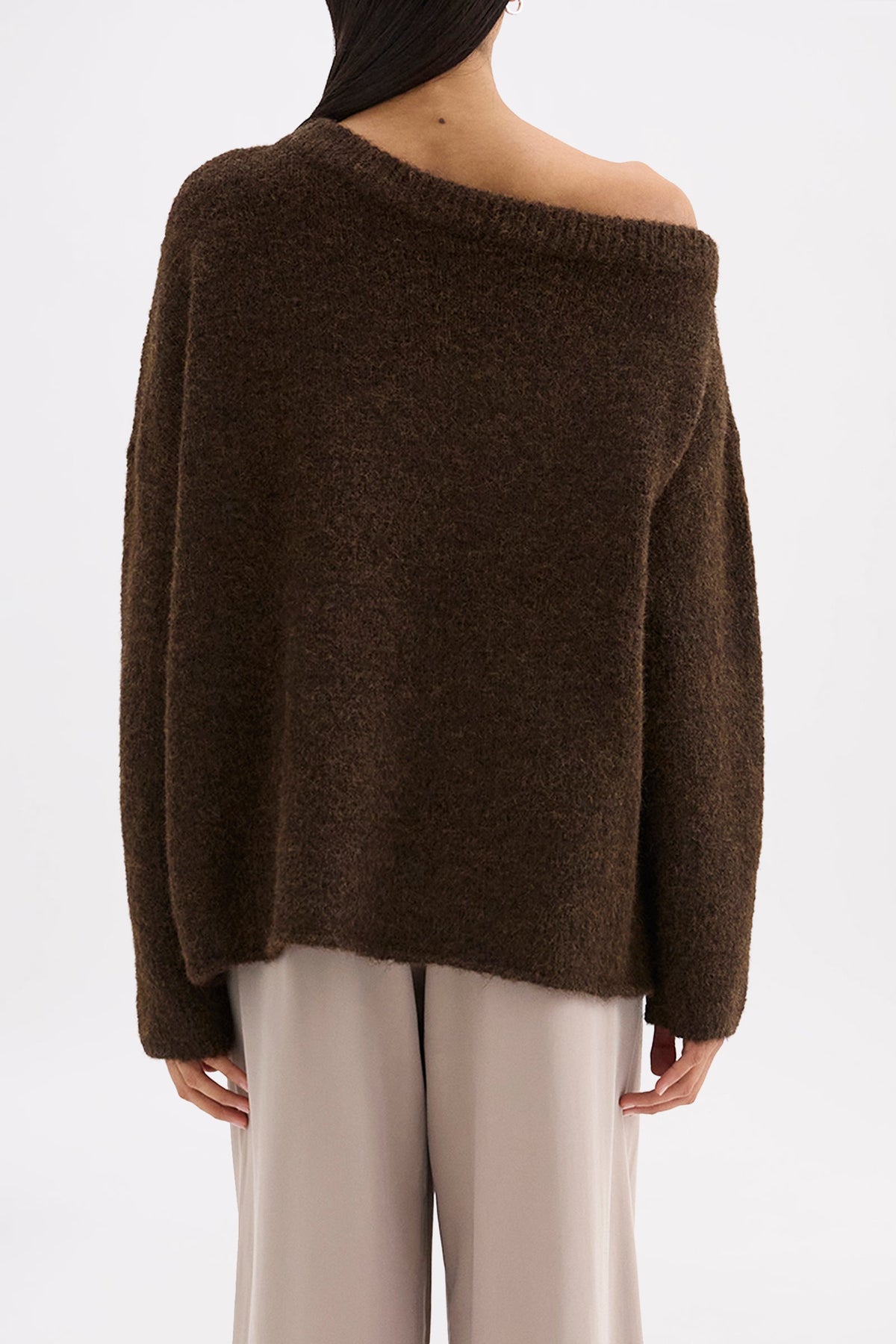 Back view of the chocolate knit showing the relaxed shape and off-shoulder neckline.