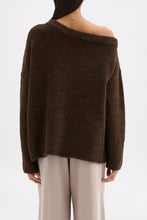 Back view of the chocolate knit showing the relaxed shape and off-shoulder neckline.