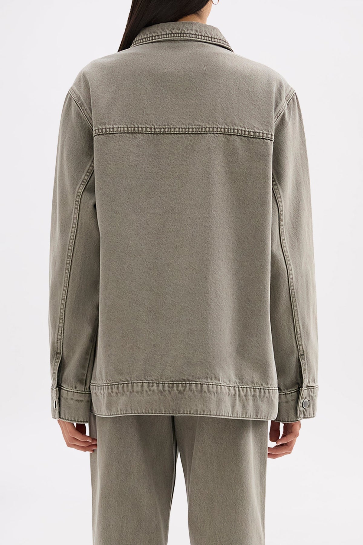 Back view showing the relaxed boxy shape, shoulder seam detailing and straight hem.