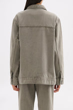 Back view showing the relaxed boxy shape, shoulder seam detailing and straight hem.