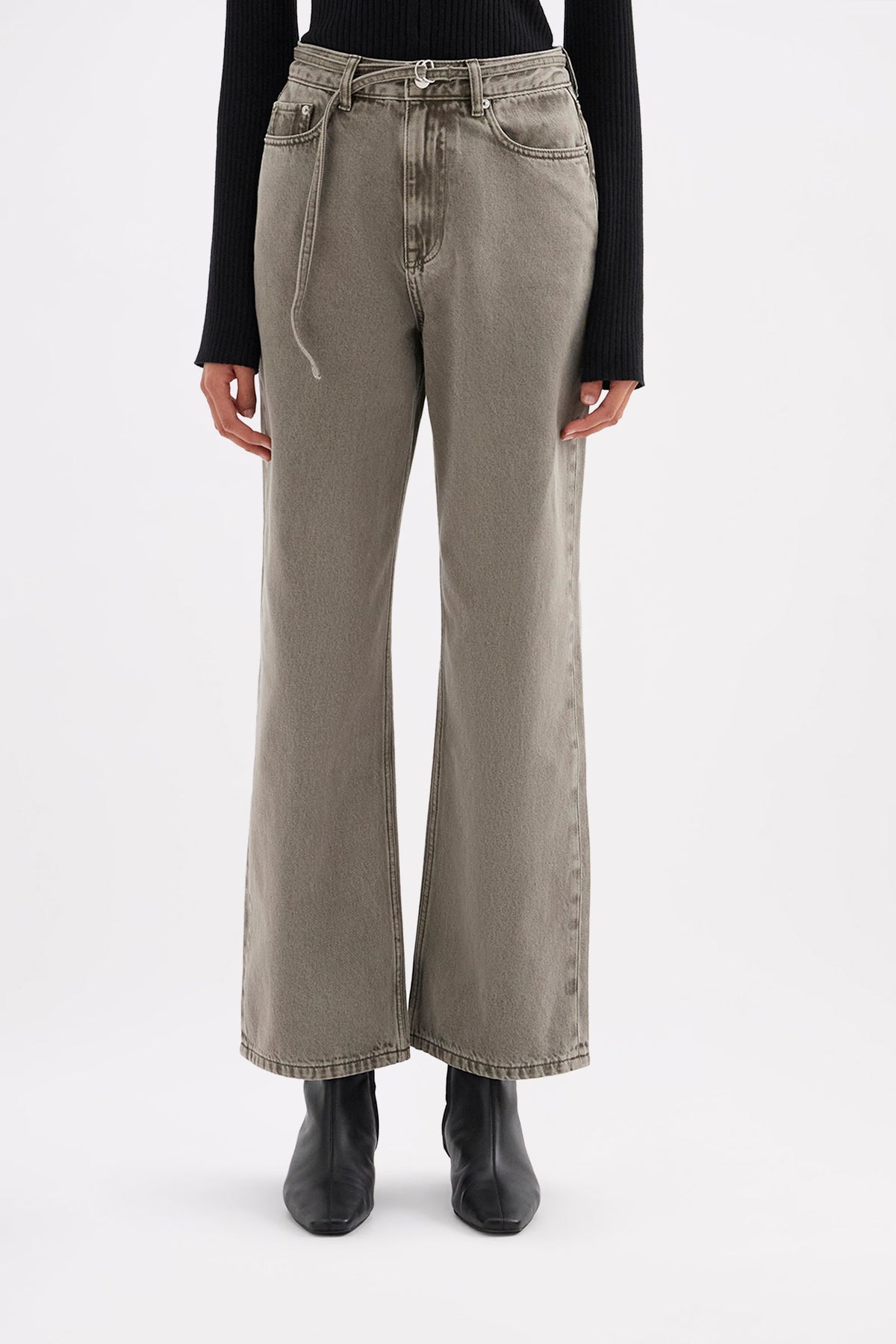 Front view of the stone grey jeans highlighting the high-rise fitted waist, relaxed legs and narrow denim belt detail.