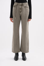 Front view of the stone grey jeans highlighting the high-rise fitted waist, relaxed legs and narrow denim belt detail.