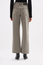 Back view of the stone grey jeans showing the rear pockets, relaxed leg and jacron patch at the waistband.
