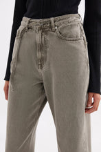 Close front view highlighting the high-rise waistband, button closure, front pockets and narrow denim belt feature.