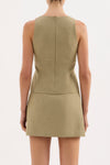 A back view shows the fitted Nude Lucy Thea Top in moss with its high back and invisible zip closure.
