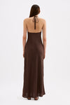 Back view of the chocolate brown maxi dress showing the halter neckline, open upper back and relaxed maxi-length skirt.