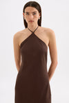 Close-up front view of the chocolate brown maxi dress showing the halter neckline and asymmetric seam through the body.