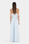 A full rear view of the cornflower blue dress showing the shirred back bodice and long, flowing skirt.