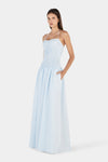 A three-quarter front view showing the halter neckline, textured shirred bodice and gathered full-length skirt.