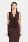 A woman wears a chocolate brown sleeveless fitted top with a deep V-neckline and lace trim.

