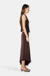 A side view shows the chocolate brown sleeveless top with a deep neckline and fitted silhouette.
