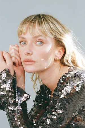 Porter Petite Thick Huggies 8mm in Gold — petite Thick Huggies 8mm are Porter's dainty everyday hoop essential — a compact, huggable design built for effortless stacking.