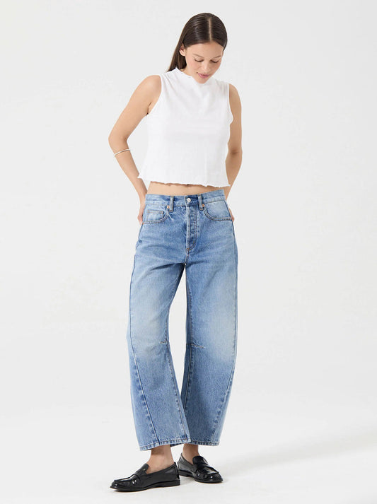 Rollas Arc Barrel Jean in Lennon Vintage — the Arc Barrel Jean in Lennon Vintage is a modern mid-rise denim style designed with a relaxed fit through the seat and a sculpted barrel-leg silhouette.