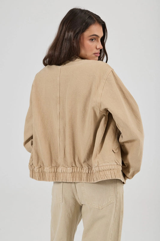 Rolla’s Dune Bomber Jacket in Dune, back view on model.

