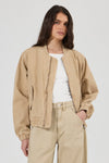 Rolla’s Dune Bomber Jacket in Dune, open front view on model.
