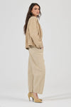 Rolla’s Dune Bomber Jacket in Dune, angled side view on model.