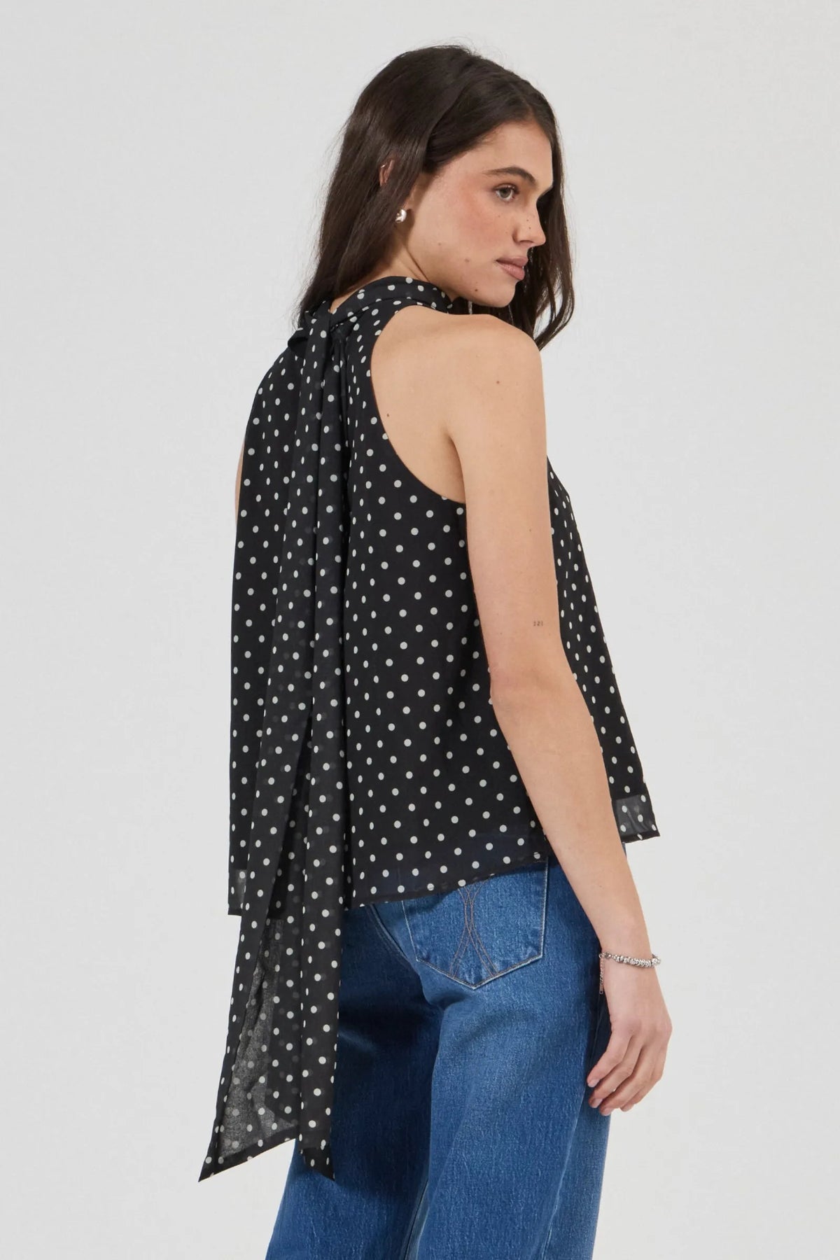 Rolla’s Edie Halter Top in Polka Dot, angled back view showing the neck tie.
model.
