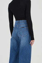 Close-up of the Rolla's Gigi Barrel Jean in Reign showing the signature angled spade back pocket detail and Rolla's branded patch