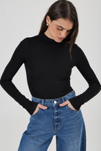 Close-up of the Rolla's Gigi Barrel Jean in Reign showing the fitted waistband, zip fly and mid to deep blue vintage wash denim