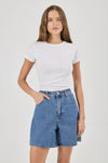 Blue denim shorts shown from the front with a super high-rise waist, scoop pockets and mid-thigh length.