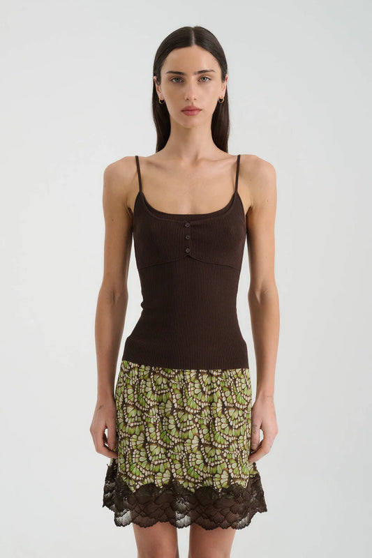 Front view of the espresso singlet styled with a patterned mini skirt and dark lace trim.