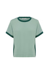 A pale green short-sleeve knit tee with dark green contrast neckline, cuffs and side detailing is shown from the front.
