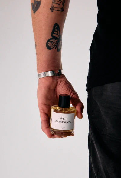 Śaint Parfum SMOKESHOW - 50ml — during dusk's golden hour, rays of sunlight reach down from the vast sky and fill your world with possibility.
