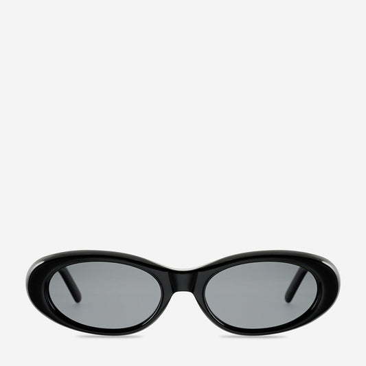 Status Anxiety Dopamine Sunglasses in black, front product view showing the oval frame and grey-tinted lenses.