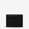 Status Anxiety Together For Now Wallet in Black — crafted from soft, shrunken pebble leather, this sleek cardholder combines durability with refined style.