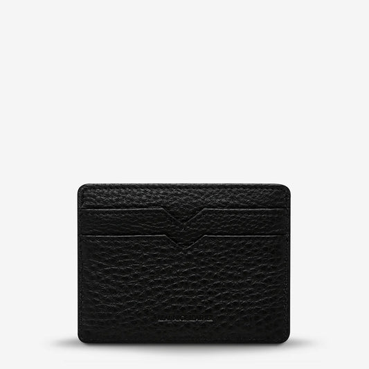 Status Anxiety Together For Now Wallet in Black — crafted from soft, shrunken pebble leather, this sleek cardholder combines durability with refined style.
