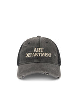 Front product view highlighting the embroidered Art Department lettering and distressed detailing across the washed black cotton cap.