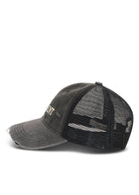Side product view showing the distressed curved peak, washed cotton front and breathable black mesh back.