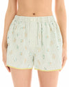 A close-up front view of the sage and white striped runner shorts showing the elasticated waistband, floral embellishments and yellow binding around the curved hems.