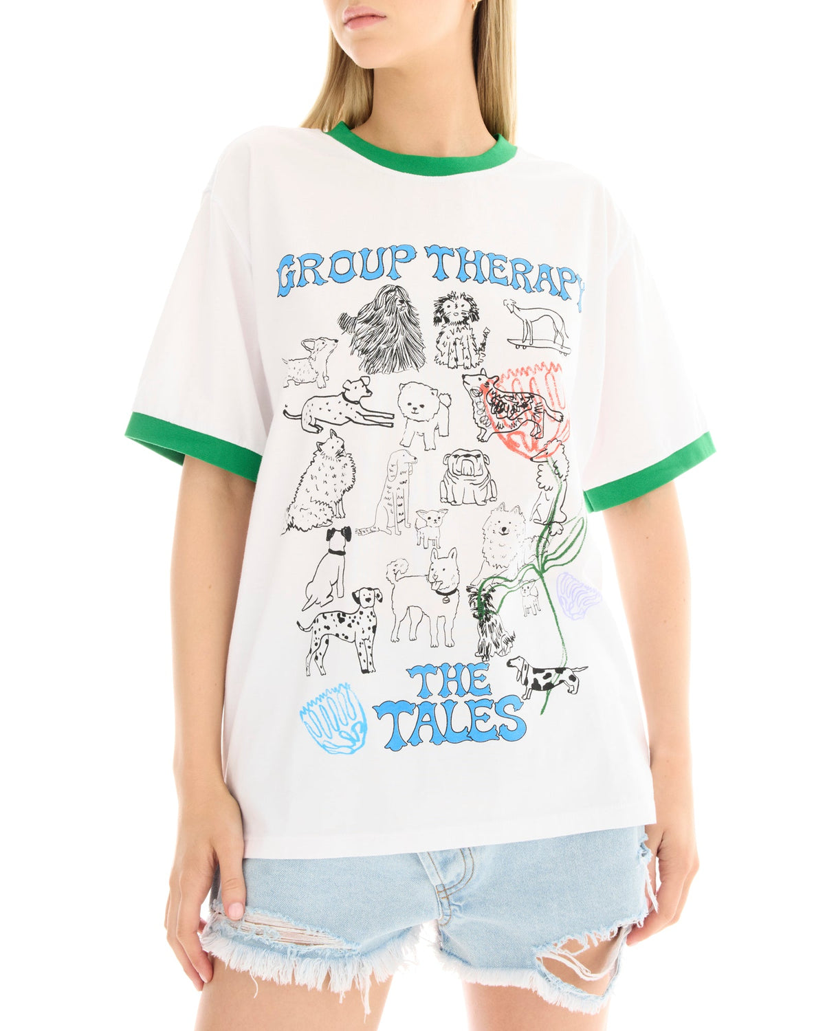 White ringer T-shirt with green ribbed neckline and sleeve cuffs, featuring a large illustrated dog graphic with blue and red lettering on the front