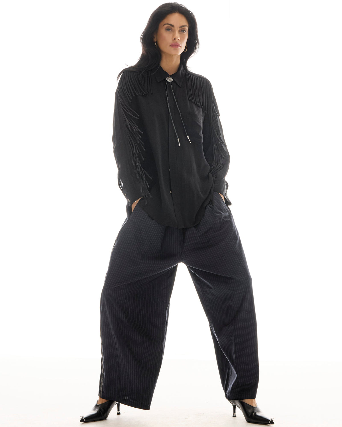 The Tales Harajuku Pin Stripe Tuxedo Wool Pants in Black — the Tales Harajuku Pin Stripe Tuxedo Wool Pants combine classic tailoring with a relaxed modern silhouette.